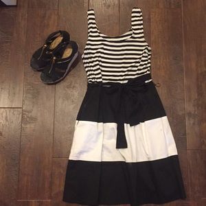 Sleeveless black and white dress with bow